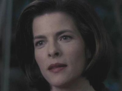 Joanna Heimbold has short hair in the picture as she is looking at something that's not visible in the picture.